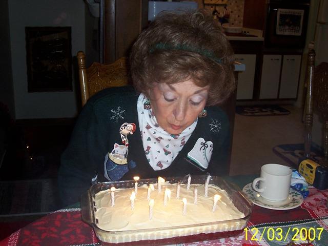 100_3357.JPG - Nana blowing out her cake.
