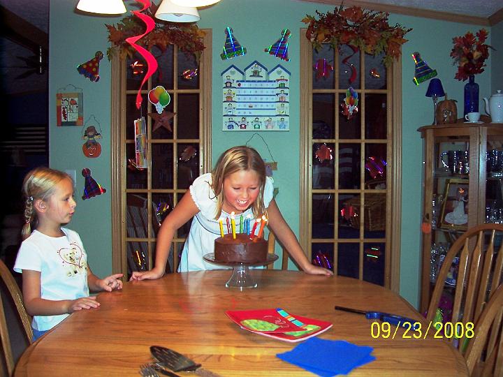 100_4040.JPG - Blowing out the candles.