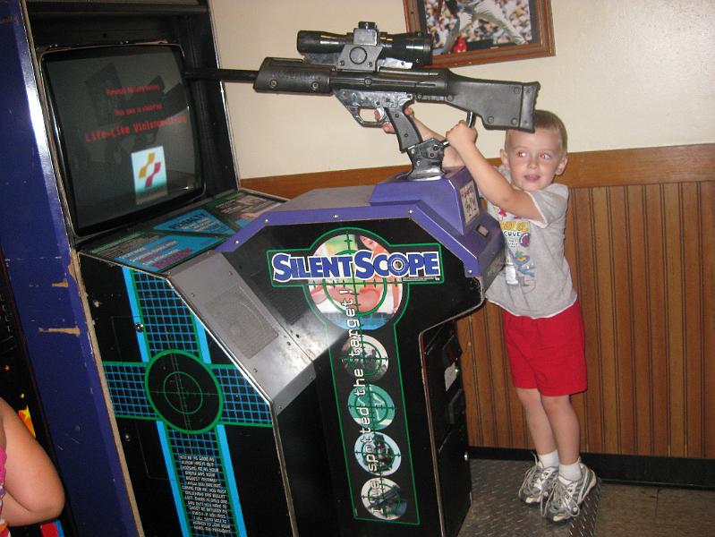 IMG_0912.JPG - Avery was trying his best to get good aim, but couldn't quite reach the controls.