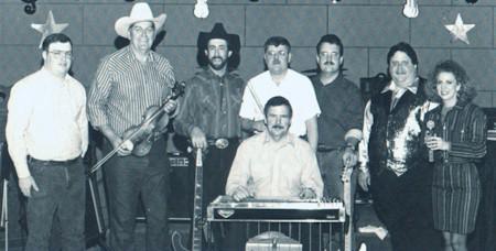 nscos92.jpg - The 1992 Nashville Sound Country Opry Show  (Mason City, Illinois): John Auxier, Roger Frantz, Mark Fisher, Les Wood, Mike Lathim, Rick Roy, Pam Gilbert, and (seated) Bill Gillis.