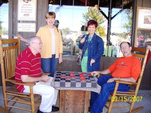 100_3068.JPG - Afterwards, we tried out the rocking chairs and played a game of checkers ... not!
