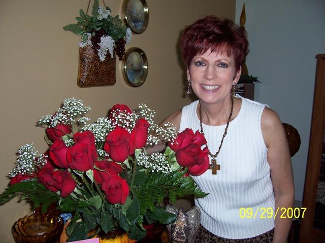 100_3084.JPG - Pam with her anniversary roses.