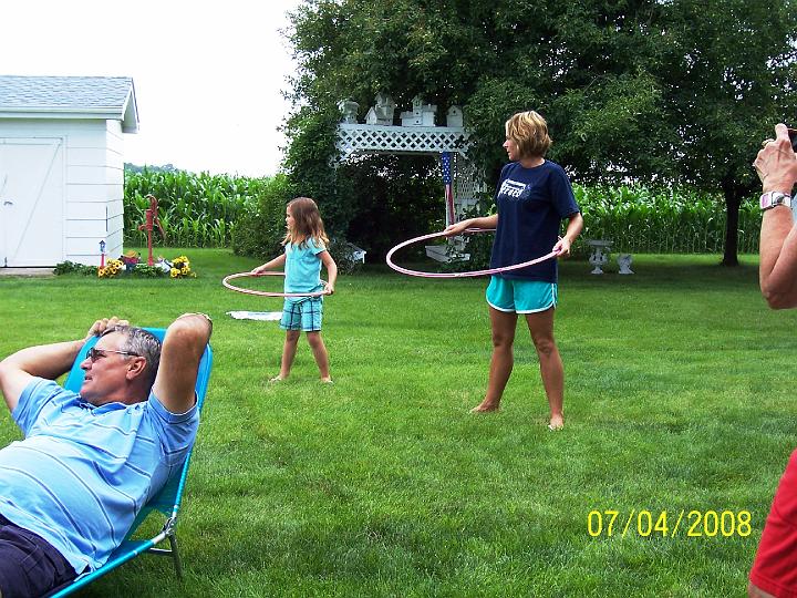 100_3805.JPG - The girls showing their hula-hoop skills.