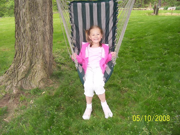 100_3603.JPG - Sydney enjoying the chair swing.