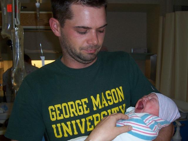 100_3568.JPG - Proud dad Trevor holds his daughter for the first time.