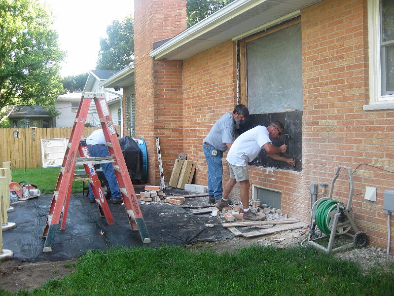 IMG_0809.JPG - Chipping away the leftover mortar and cleaning up the brick.
