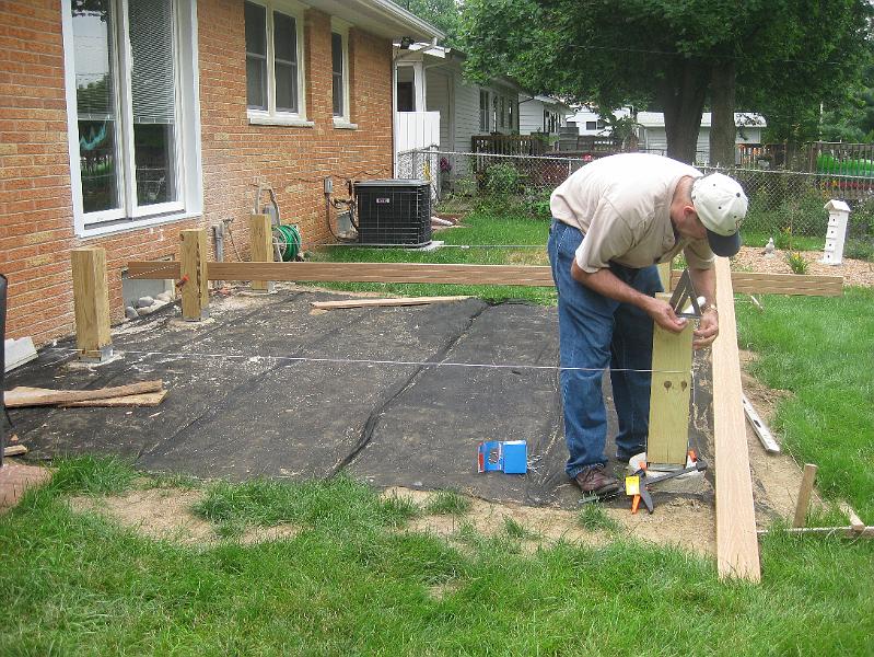 IMG_0834.JPG - July 11:  Now that the door is done, the deck construction begins ...