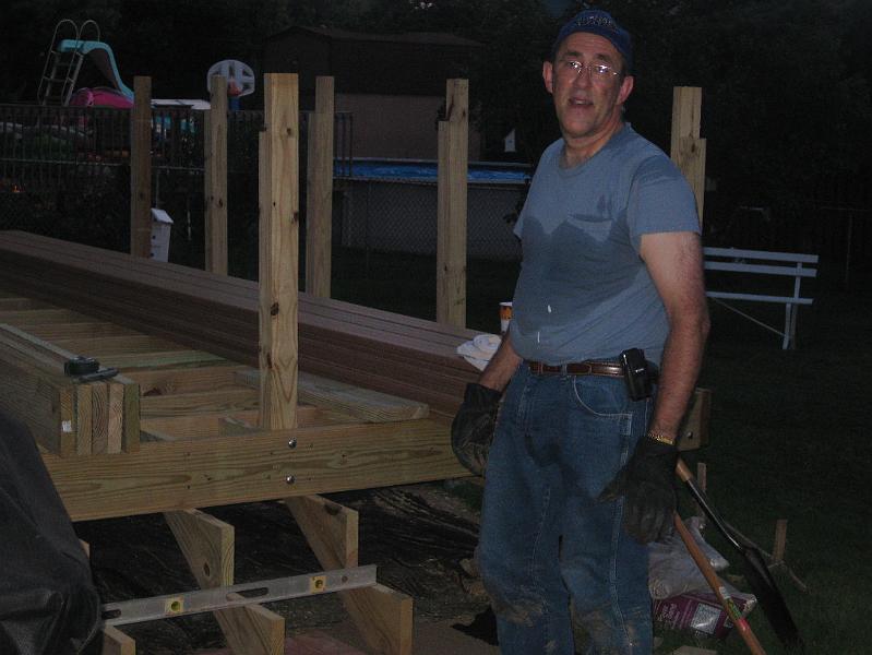 IMG_0867.JPG - July 23:  Beams and joists in place, railing posts bolted on, stair stringers attached, and patio blocks in and leveled.