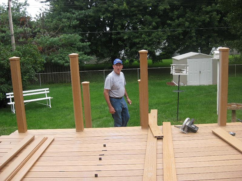 IMG_0878.JPG - August 1:  Deck boards being spaced and cut around posts.