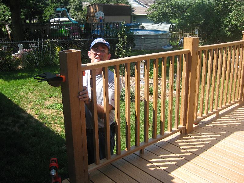 IMG_0900.JPG - August 8:  Attaching the next-to-last set of deck rails.