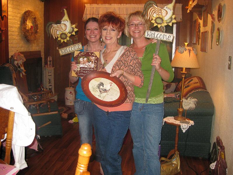 IMG_0453.JPG - Do the girls know their mom or what?  Both of them got Pam the same chicken "Welcome" sign!