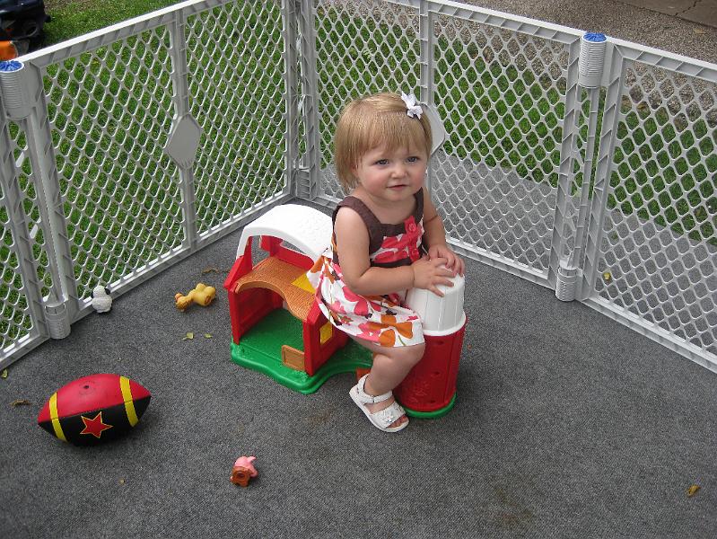 IMG_0861.JPG - Macie thought her farm set was a riding toy!